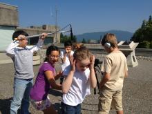 kids filming outdoors with recording equipment