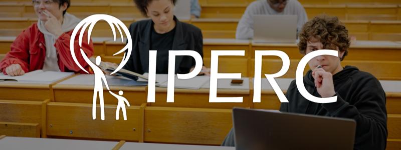 IPERC logo in front of people in classroom