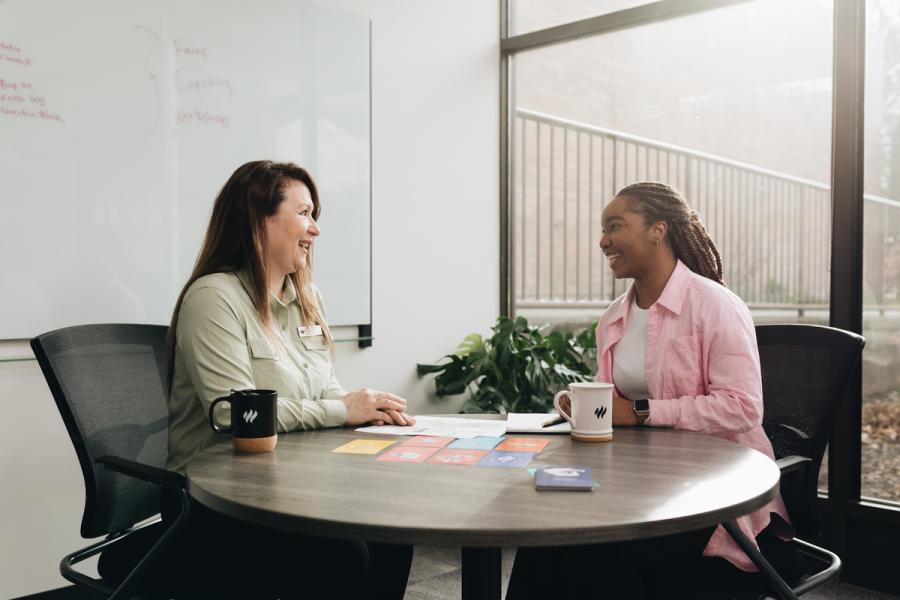 two people having a seated conversation