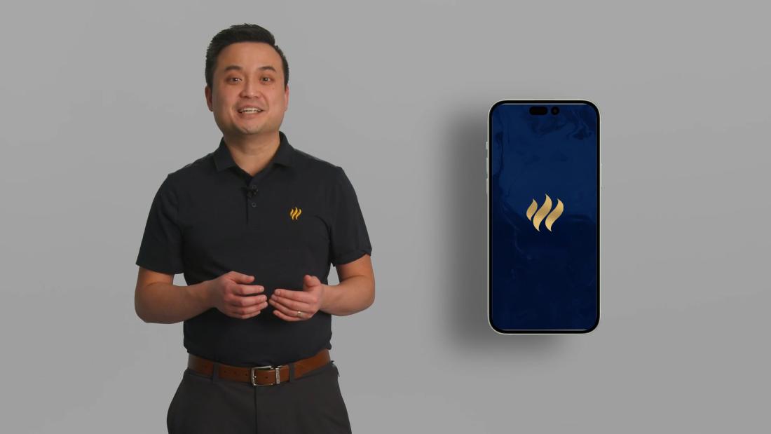 clement wee standing in front of a grey wall beside a phone mockup